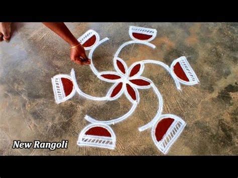 A Person Is Painting On The Ground With Red And White Paint In Front Of