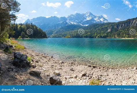 Rocky Bathing Beach At Lake Shore Eibsee View To Zugspitze Mountain