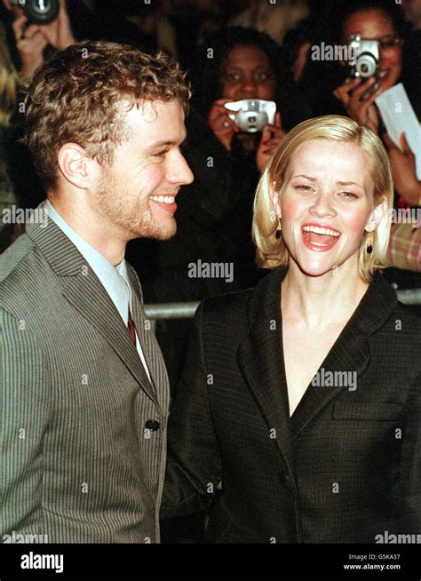 Actor Ryan Phillippe And Actress Reese Witherspoon Share A Laugh As