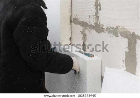 Builder Installing Rigid Styrofoam Insulation Board Stock Photo