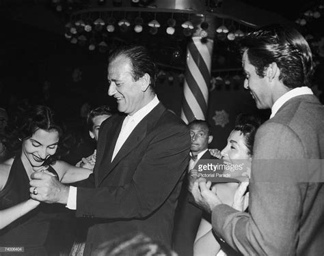 American Actor John Wayne With His Wife Pilar Palette And Actor Rory