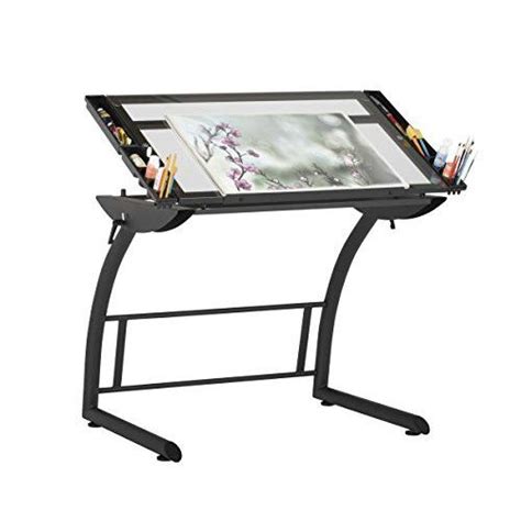 A Drawing Table With An Easel And Pencils