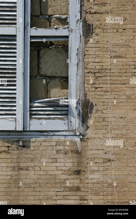 One Damaged Window Shutters In Derelict Property Stock Photo Alamy