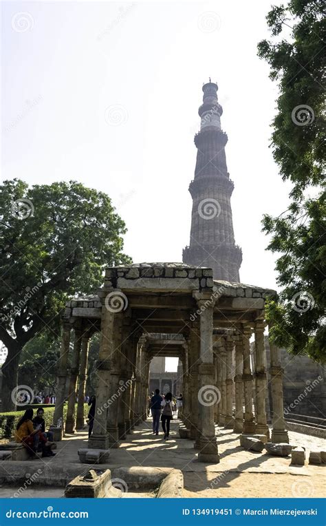 Qutb Minar Tower Seen Through The Ruined Quwwat Ul Islam Mosque At