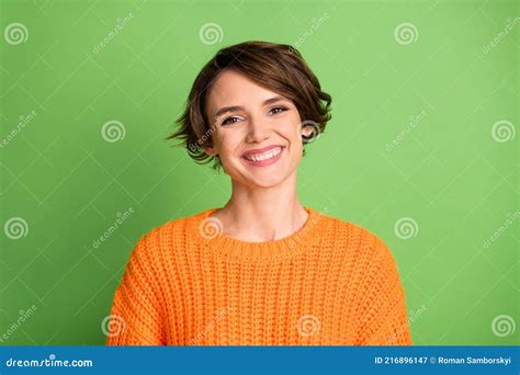 Portrait Of Optimistic Brunette Lady Wear Orange Sweater Isolated On