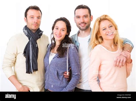 View of a Group of 4 young attractive people on a white background ...