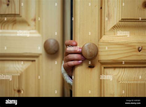 Scared children opening door hi-res stock photography and images - Alamy