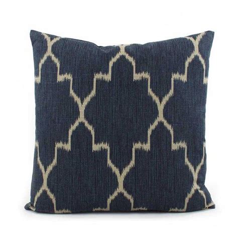 A Blue And White Pillow With An Intricate Design On The Front Sitting