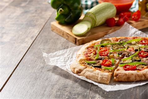 Free Photo Vegetarian Pizza With Zucchini Tomato Peppers And Mushrooms