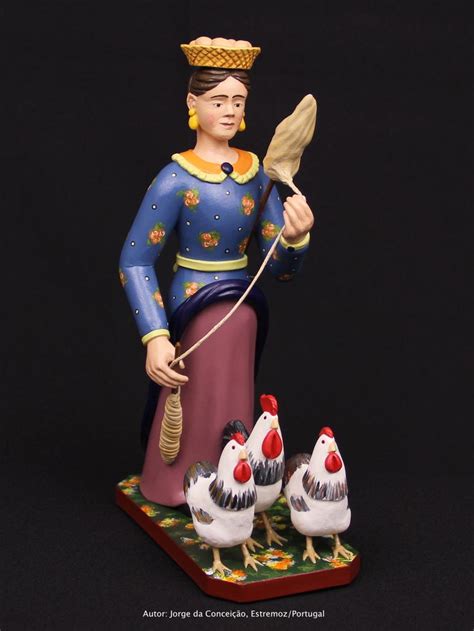 A Figurine Of A Woman Holding A Brush And Two Chickens On A Black