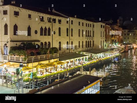 Restaurants Bordering the Grand Canal in Venice at Night Stock Photo - Alamy