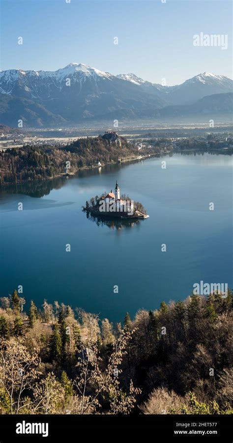 Panorama of lake bled during sunrise. Lake bled Castle in the background Stock Photo - Alamy