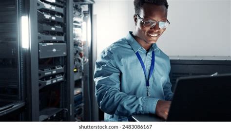 Laptop Server Room Technician Programming Software Stock Photo