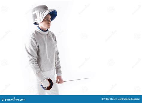 Side View Of Fencer In Uniform Holding Rapier In Hand Stock Photo