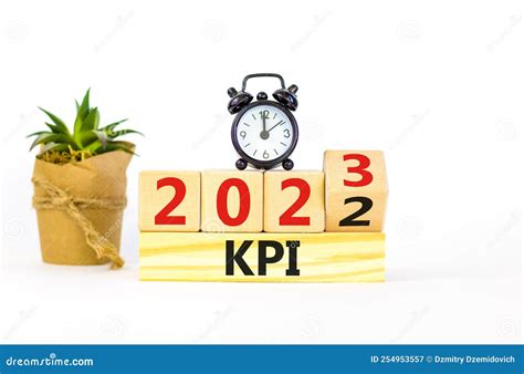 Kpi Key Performance Indicator Symbol Turned Wooden Cubes With Words