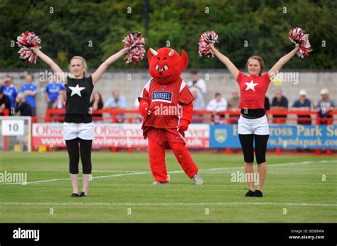 The Crawley town football club mascot a red devil entertains the crowds ...