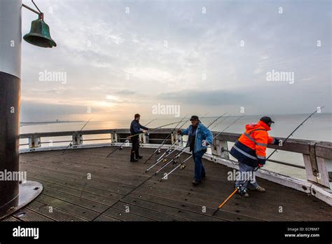 Belgian North Sea Coast Beach Pier Fishermen Stock Photo Alamy