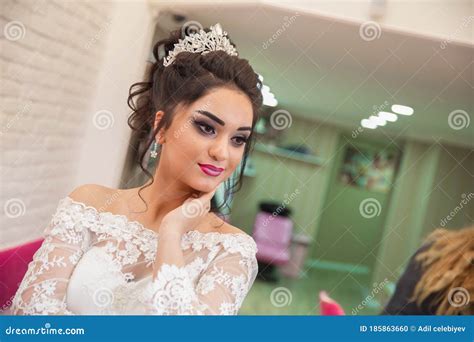 The Bride Puts Her Hand On Her Shoulder And Takes A Picture At The