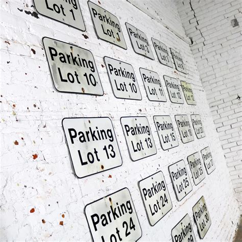 Twenty-Three Vintage Metal Parking Lot Number Signs – warehouse 414