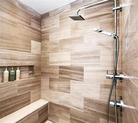 There Is A Shower Head In The Corner Of This Bathroom With Wooden Tiles