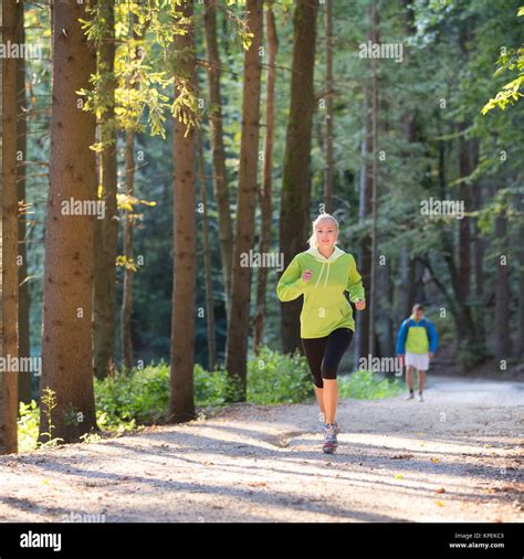 Pretty Young Girl Runner In The Forest Stock Photo Alamy