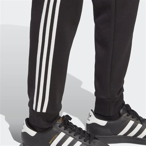 Mens Clothing Adicolor Classics 3 Stripes Pants Black Adidas Egypt