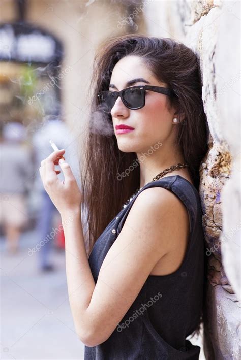 Glamorous Brunette Woman With Sunglasses Smoking Retro Style Stock