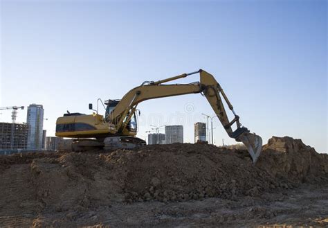 Excavator Working At Construction Site Backhoe During Earthworks Stock