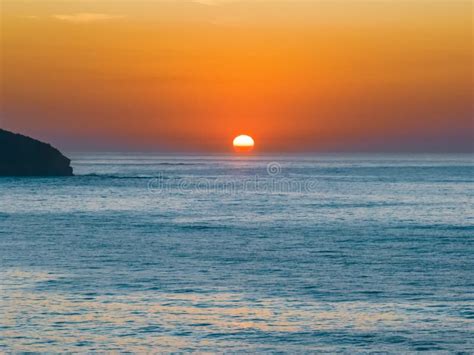 Soft Hazy Sunrise Seascape And Orange Sky And Full Sun Stock Photo