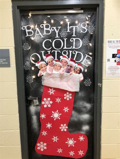 A Door Decorated With Christmas Stockings And Baby It S Cold Outside