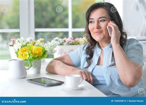 Portrait Of Beautiful Mature Woman Talking On Phone Stock Photo Image