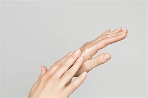 Premium Photo A Woman Applies A Cosmetic Cream On Her Hands Hand Skin