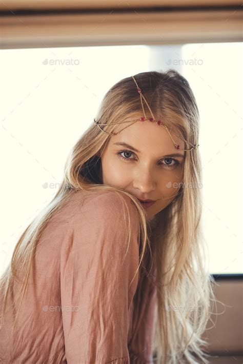 Beautiful Blonde Hippie Girl In Hair Decoration Looking At Camera Stock Photo By LightFieldStudios