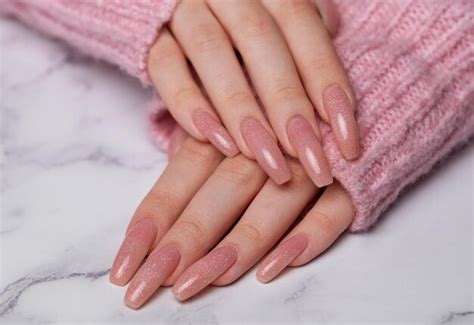 Premium Photo Female Hands With Pink Nail Design