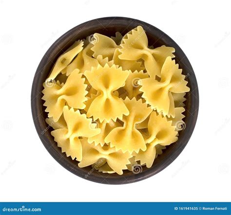 Raw Farfalle Pasta In Bowl Isolated On White Background Stock Image