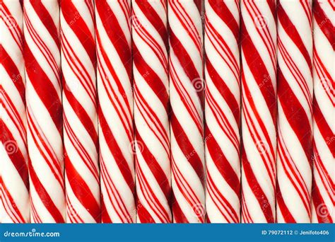 Background Of Red And White Striped Christmas Candy Canes Stock Photo