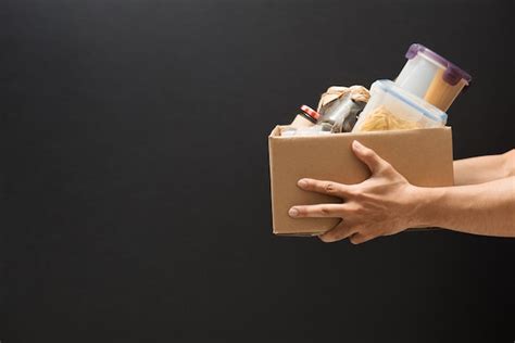 Premium Photo Volunteer With Box Of Food For Poor Donation Concept