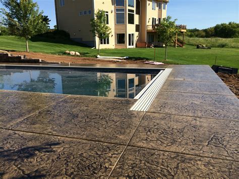 Decorative Concrete Pool Deck With Cantilevered Edge Over Retaining Wall By Sierra Concrete Arts