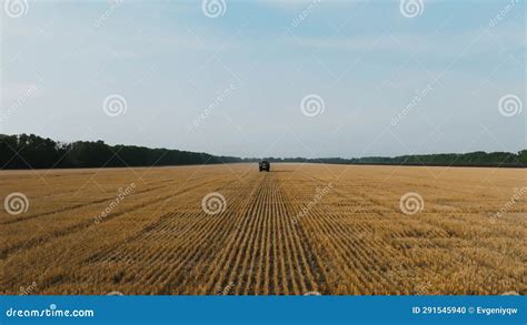 Aerial View Of Farmer Fertilizing Agricultural Field Spreading Mineral