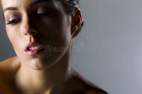 Elegance In Curves Brunette Beauty Graces Studio Space With Style Stock Photo Image Of