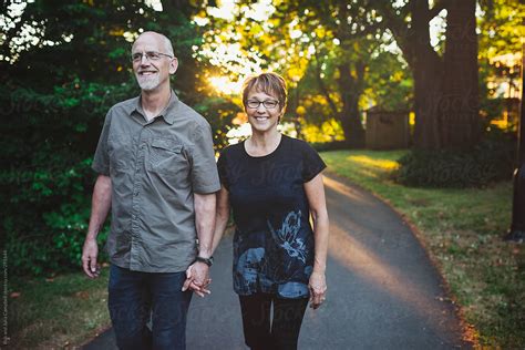 Middle Aged Retired Couple Enjoying A Walk Together Outside In Nature