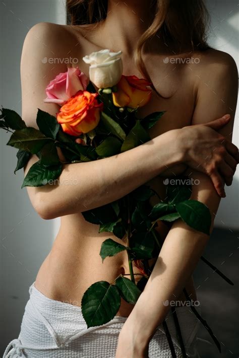 Beautiful Woman Nude With Flowers Rose Stock Photo By Nickbulanov