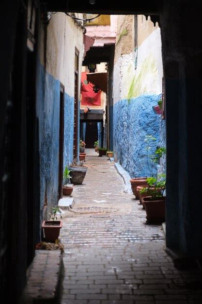 Premium Photo Narrow Alley Amidst Buildings