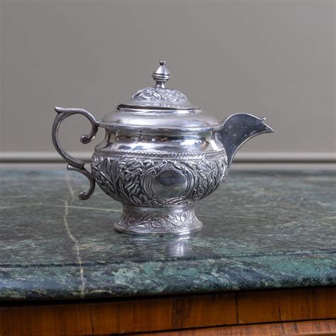 Lot An Oriental Chased Small Silver Teapot Milk Jug Chased With