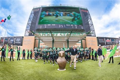 [Football players entering stadium] - UNT Digital Library