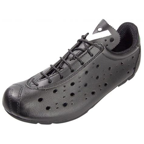 A Black Shoe With Holes On The Side