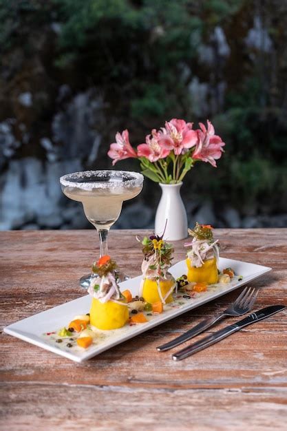 Premium Photo Typical Peruvian Dish Causa Rellena At A Restaurant Table