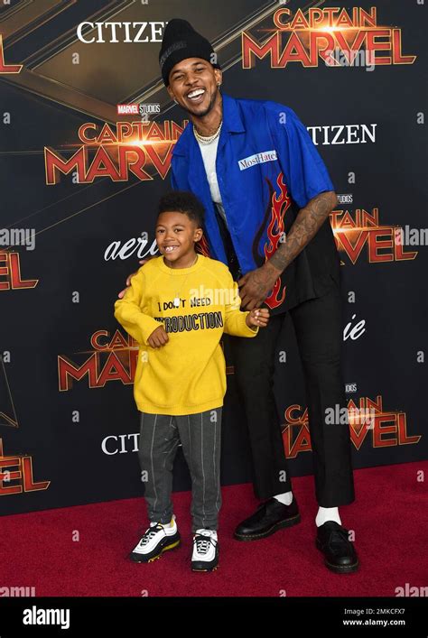 Nick Young, right, and his son Nick Young Jr. arrive at the world premiere of "Captain Marvel ...