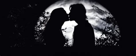 Premium Ai Image Moonlit Embrace A Passionate Kiss Under The Moon