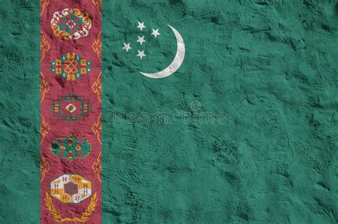 Turkmenistan Flag Depicted In Bright Paint Colors On Old Relief